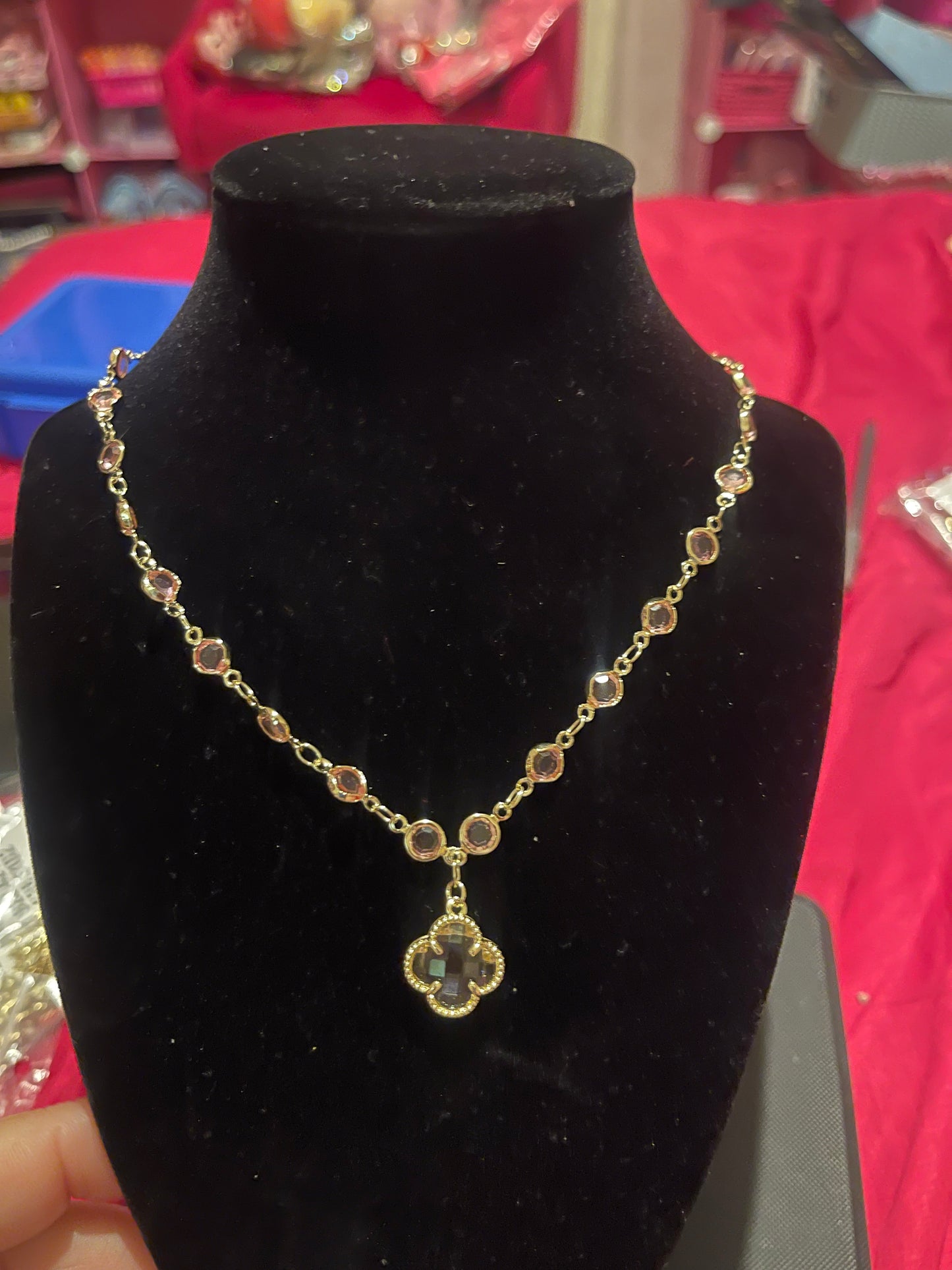 Gold chain with pink pendant